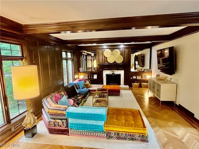 23547 Quail Holw, Westlake, OH 44145 - sitting room with plenty of natural light, beam ceiling, a fireplace, and wooden walls