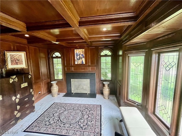 23547 Quail Holw, Westlake, OH 44145 - living area with a wooden ceiling with exposed beams, a fireplace with flush hearth, marble finish flooring, wood walls, and crown molding