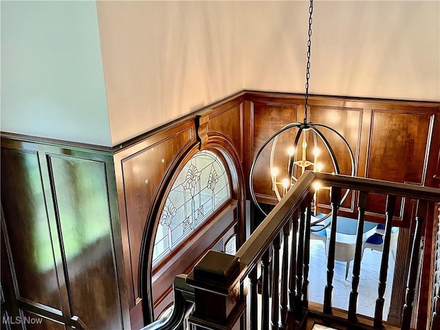 23547 Quail Holw, Westlake, OH 44145 - detailed view of a decorative wall, a chandelier, and a wainscoted wall