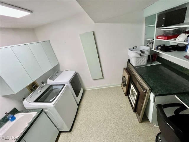 23547 Quail Holw, Westlake, OH 44145 - washroom featuring washing machine and dryer and cabinet space
