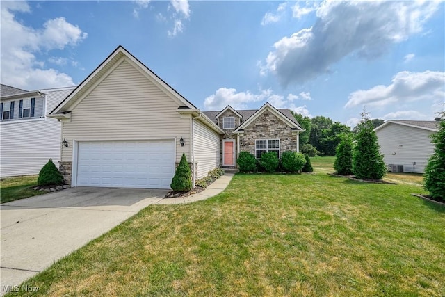 4504 Ledge Ct, Kent, OH 44240 - traditional home with stone siding, driveway, a front yard, and an attached garage