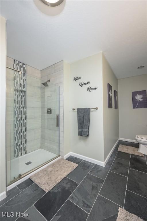 4504 Ledge Ct, Kent, OH 44240 - full bathroom featuring a shower stall and baseboards