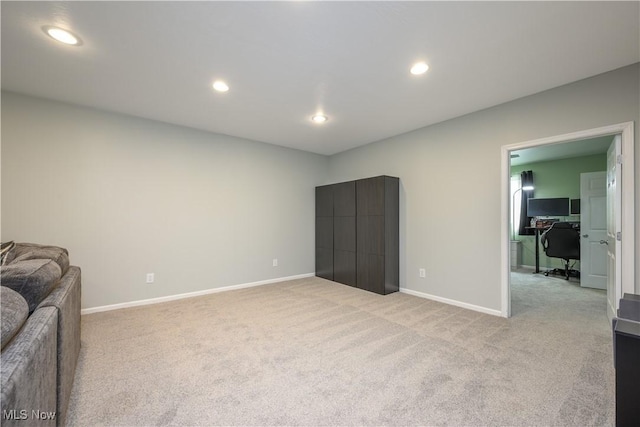 4504 Ledge Ct, Kent, OH 44240 - living area with light carpet, recessed lighting, and a desk