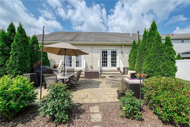4504 Ledge Ct, Kent, OH 44240 - rear view of property featuring french doors, a patio, an outdoor living space, and roof with shingles