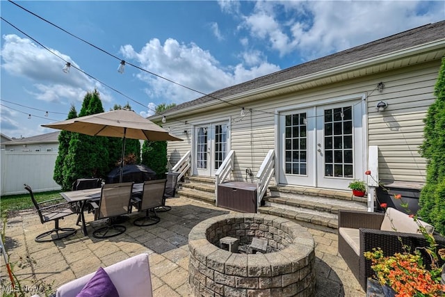 4504 Ledge Ct, Kent, OH 44240 - view of patio / terrace with french doors, entry steps, an outdoor fire pit, and outdoor dining area