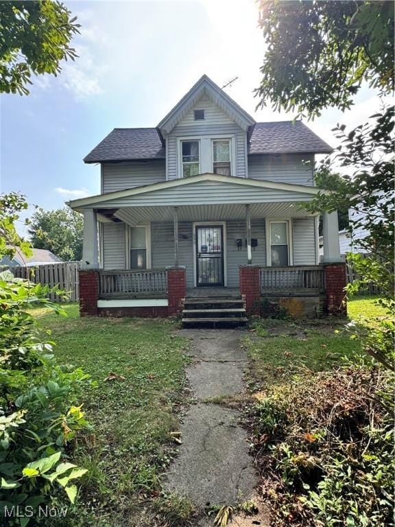 699 E 156th St, Cleveland, OH 44110 - view of front of property featuring covered porch and roof with shingles