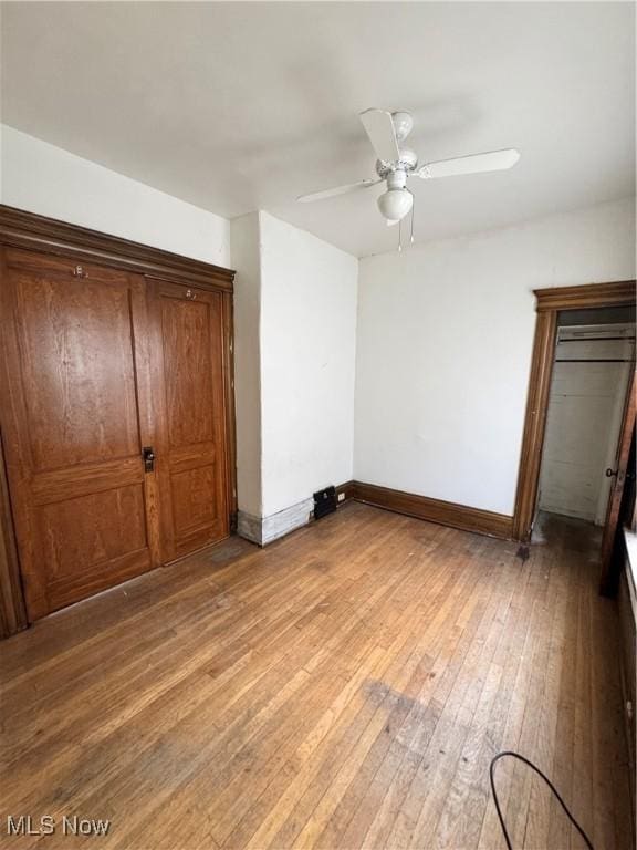 699 E 156th St, Cleveland, OH 44110 - unfurnished bedroom with light wood-style flooring and ceiling fan