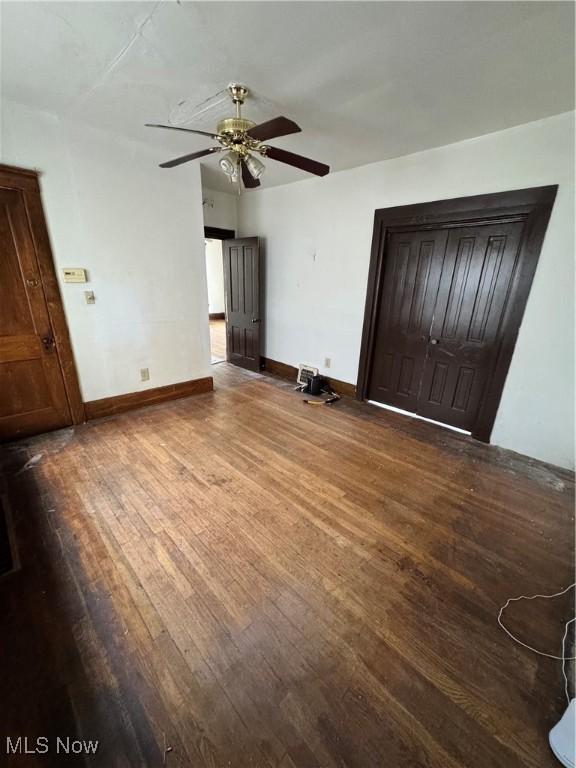 699 E 156th St, Cleveland, OH 44110 - unfurnished bedroom with wood finished floors and a ceiling fan