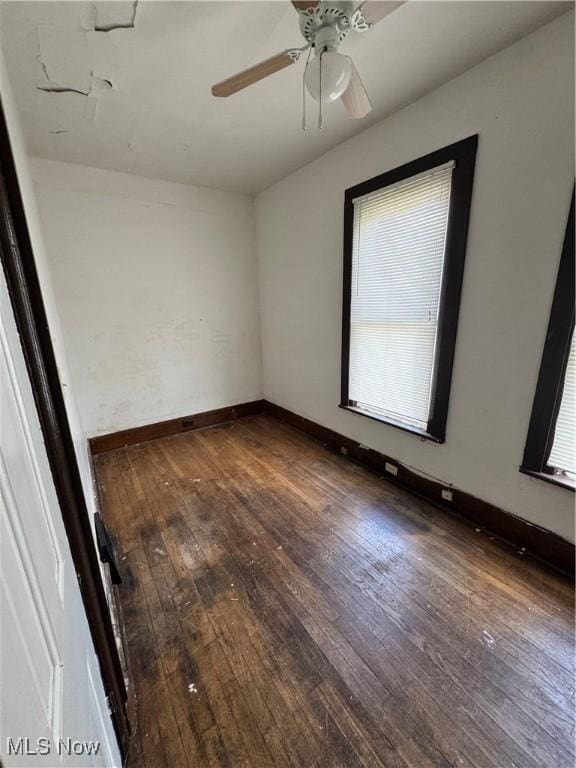 699 E 156th St, Cleveland, OH 44110 - spare room featuring wood-type flooring and ceiling fan