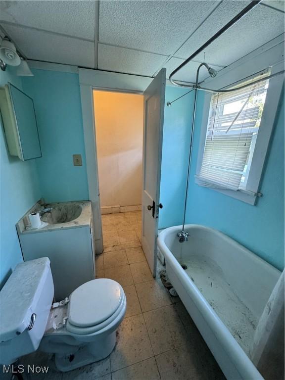 699 E 156th St, Cleveland, OH 44110 - full bathroom featuring a drop ceiling, shower / washtub combination, vanity, and tile patterned floors