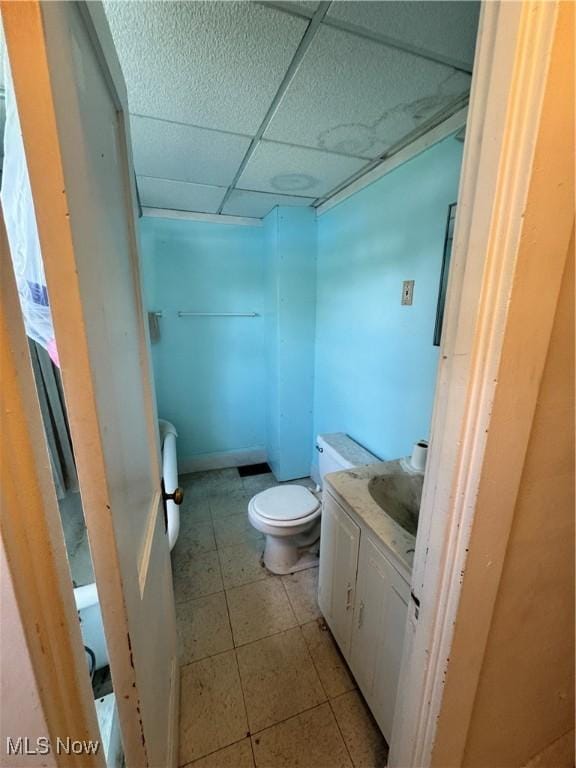 699 E 156th St, Cleveland, OH 44110 - half bath featuring a paneled ceiling, vanity, and tile patterned floors
