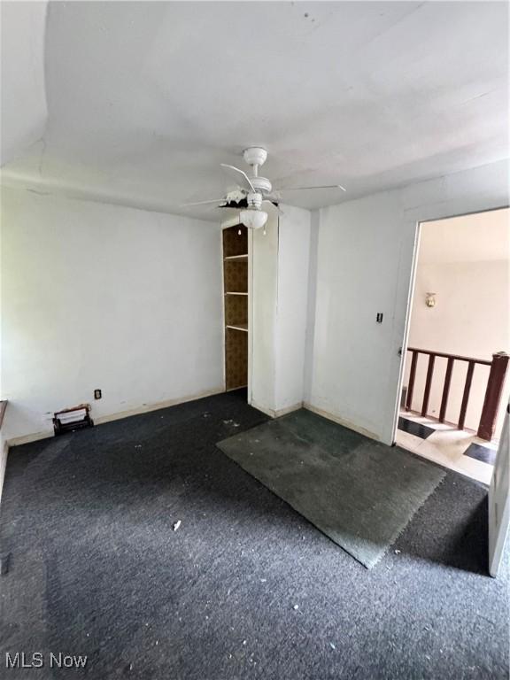 699 E 156th St, Cleveland, OH 44110 - unfurnished living room with a ceiling fan