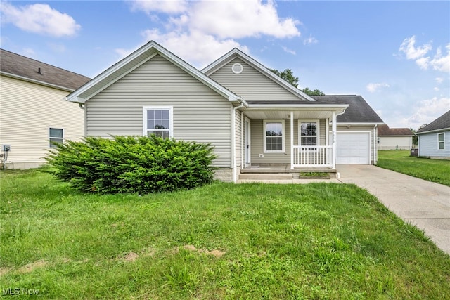 1350 Elmside St, Alliance, OH 44601 - ranch-style home with a porch, concrete driveway, and a front lawn