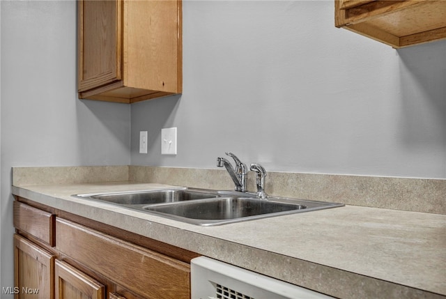 1350 Elmside St, Alliance, OH 44601 - kitchen featuring light countertops and brown cabinets