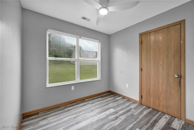 1350 Elmside St, Alliance, OH 44601 - unfurnished bedroom featuring wood finished floors, a ceiling fan, and a closet