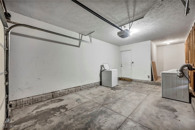 1350 Elmside St, Alliance, OH 44601 - garage featuring a garage door opener and washer / dryer
