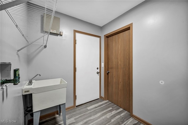 1350 Elmside St, Alliance, OH 44601 - washroom featuring light wood-type flooring and baseboards