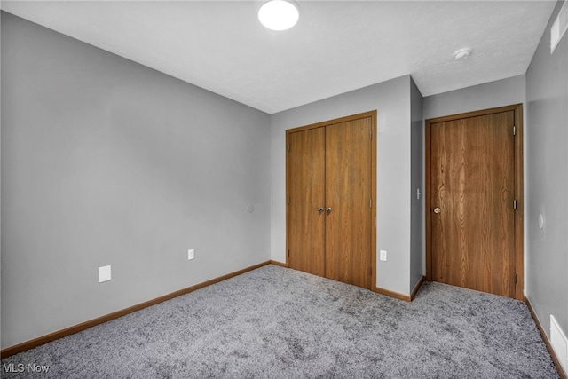 1350 Elmside St, Alliance, OH 44601 - unfurnished bedroom with carpet flooring and a closet