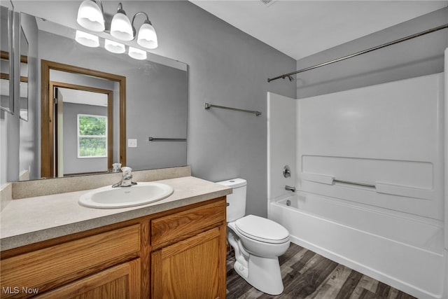 1350 Elmside St, Alliance, OH 44601 - full bath with vanity, shower / washtub combination, and wood finished floors