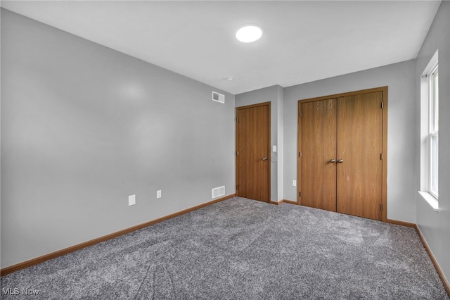 1350 Elmside St, Alliance, OH 44601 - unfurnished bedroom featuring a closet and carpet flooring