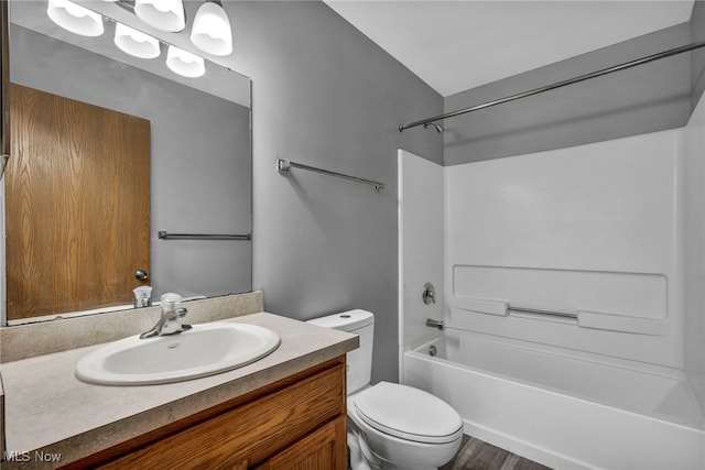 1350 Elmside St, Alliance, OH 44601 - full bath featuring vanity, tub / shower combination, and wood finished floors