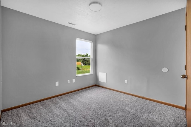 1350 Elmside St, Alliance, OH 44601 - spare room with baseboards and carpet flooring
