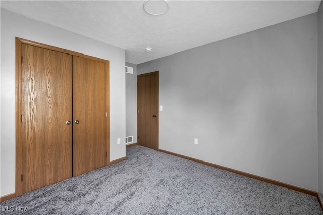1350 Elmside St, Alliance, OH 44601 - unfurnished bedroom featuring carpet floors and a closet