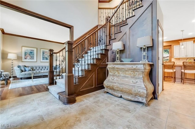 32305 Monaco Pl, Avon Lake, OH 44012 - stairs with ornamental molding and tile patterned flooring