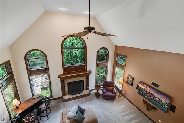 32305 Monaco Pl, Avon Lake, OH 44012 - carpeted living area with high vaulted ceiling, a tiled fireplace, and a ceiling fan