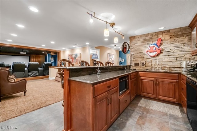 32305 Monaco Pl, Avon Lake, OH 44012 - kitchen with dishwasher, a peninsula, built in microwave, open floor plan, and brown cabinets