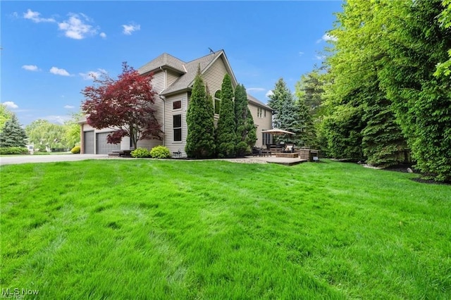 32305 Monaco Pl, Avon Lake, OH 44012 - view of property exterior with a yard, concrete driveway, and a garage