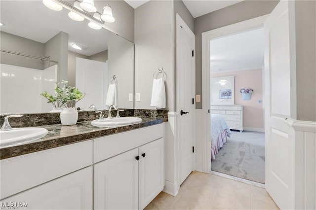 32305 Monaco Pl, Avon Lake, OH 44012 - full bathroom featuring double vanity, tile patterned floors, connected bathroom, and a shower