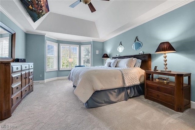 32305 Monaco Pl, Avon Lake, OH 44012 - carpeted bedroom with multiple windows, a raised ceiling, ornamental molding, and a ceiling fan