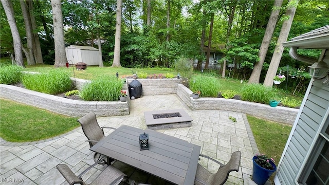 6190 3rd Ave, Kent, OH 44240 - view of patio featuring a fire pit, a shed, and outdoor dining space