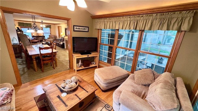 6190 3rd Ave, Kent, OH 44240 - living room featuring a ceiling fan, wood finished floors, vaulted ceiling, and a chandelier