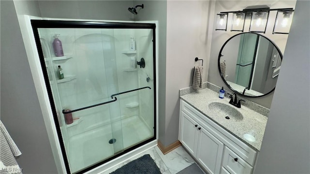 6190 3rd Ave, Kent, OH 44240 - bathroom with a shower stall, vanity, and marble look tile flooring