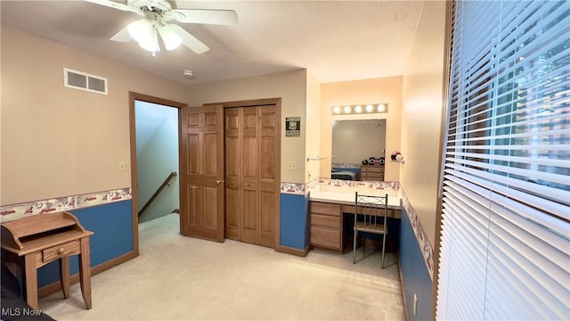 6190 3rd Ave, Kent, OH 44240 - bedroom featuring light carpet, built in study area, a closet, and a ceiling fan