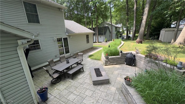 6190 3rd Ave, Kent, OH 44240 - view of patio / terrace featuring a fire pit, a storage shed, outdoor dining space, and grilling area