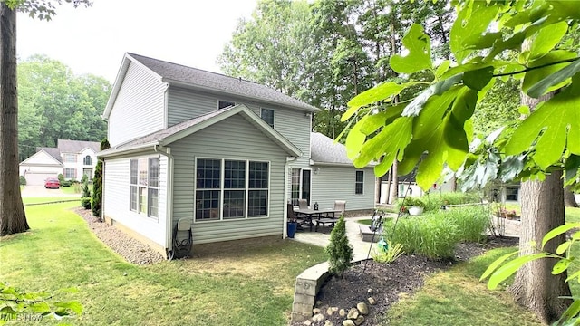 6190 3rd Ave, Kent, OH 44240 - back of property with a patio area and a lawn