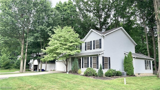 6190 3rd Ave, Kent, OH 44240 - traditional home with a front lawn, a garage, and concrete driveway