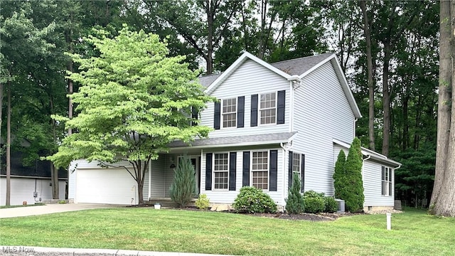 6190 3rd Ave, Kent, OH 44240 - traditional-style home featuring concrete driveway, a front lawn, and an attached garage