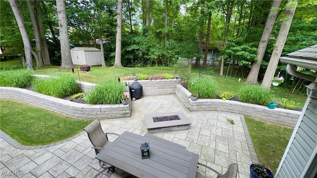 6190 3rd Ave, Kent, OH 44240 - view of patio / terrace featuring a fire pit and a storage shed