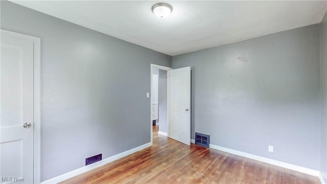1672 Battery B St, Akron, OH 44305 - spare room featuring baseboards and wood finished floors
