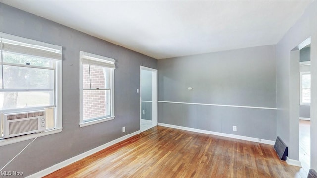 1672 Battery B St, Akron, OH 44305 - spare room featuring wood finished floors and cooling unit
