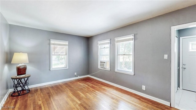 1672 Battery B St, Akron, OH 44305 - empty room featuring wood finished floors and cooling unit