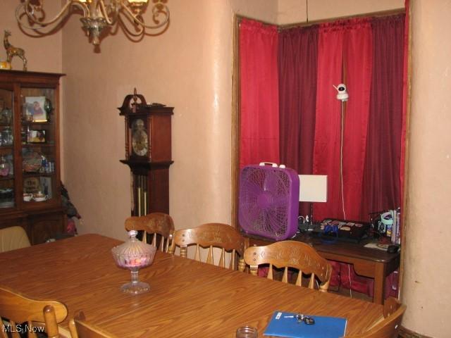 124 Hickory St, Andover, OH 44003 - dining area with a chandelier