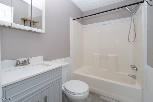 1214 E 360th St, Eastlake, OH 44095 - bathroom featuring shower / washtub combination, vanity, a textured ceiling, and a wainscoted wall