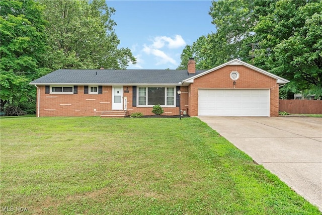 6767 Chippewa Ave NW, North Canton, OH 44720 - ranch-style house featuring concrete driveway, brick siding, a chimney, and a garage