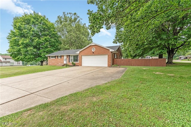 6767 Chippewa Ave NW, North Canton, OH 44720 - ranch-style home featuring brick siding, an attached garage, and concrete driveway