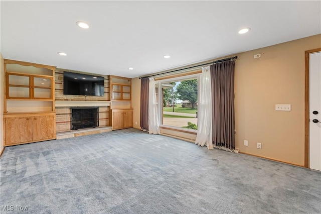 6767 Chippewa Ave NW, North Canton, OH 44720 - unfurnished living room featuring carpet floors, a fireplace, and recessed lighting